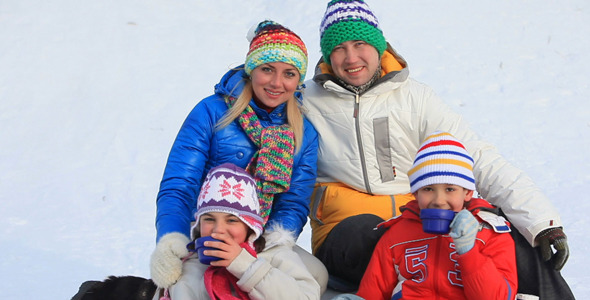 Family Drinking Tea in Winter