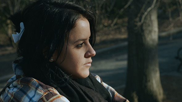 Girl Sitting and Starring in Central Park