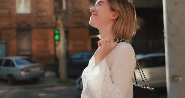 Happy Woman Walking in the City