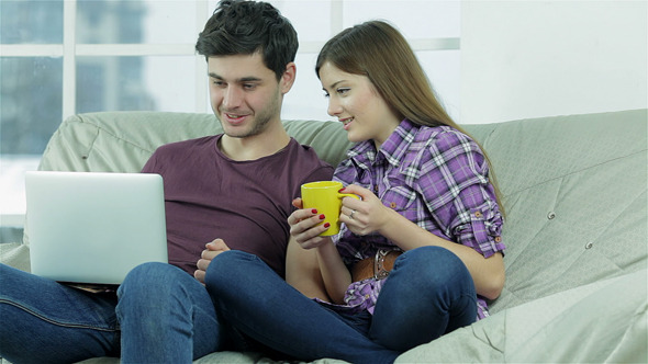 Read Your Mail On A Laptop With A Cup Of Tea