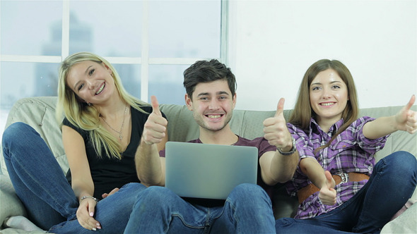 Guy And Two Girls Show Thumbs Top Directly Camera alt