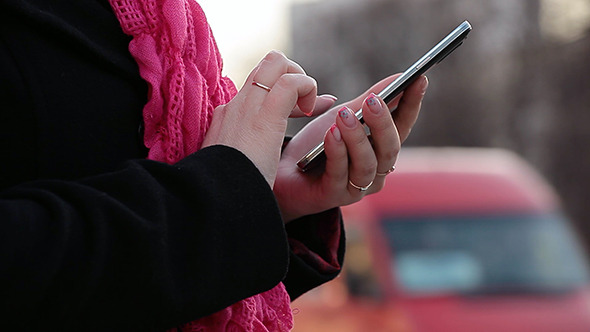 Girl on Street Use Mobile Phone