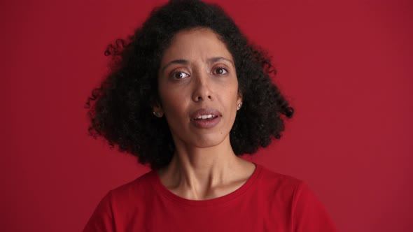 Smiling African woman positively shaking head