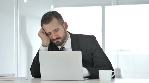 Tense Middle Aged Businessman Reacting to Loss While Reading Documents