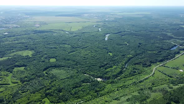 Drone Flying Above Forest and River