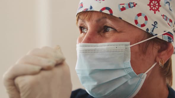 Elderly Female Doctor in Medical Mask