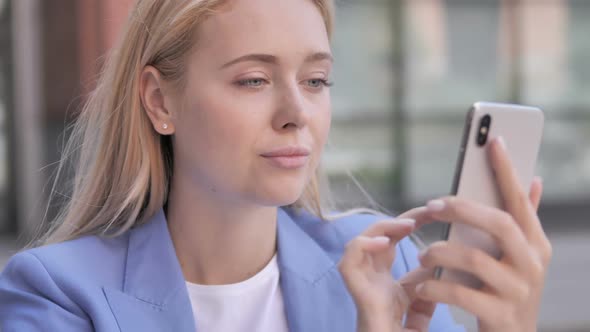 Young Businesswoman Using Smartphone