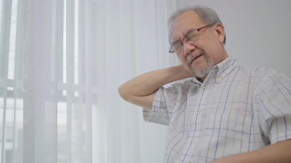 Asian senior man having neck pain, cervical spine sickness