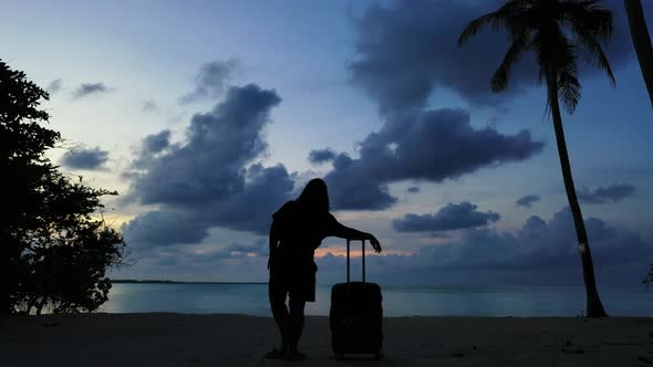 Single lady loves life on tropical island beach break by blue green ocean and white sandy background