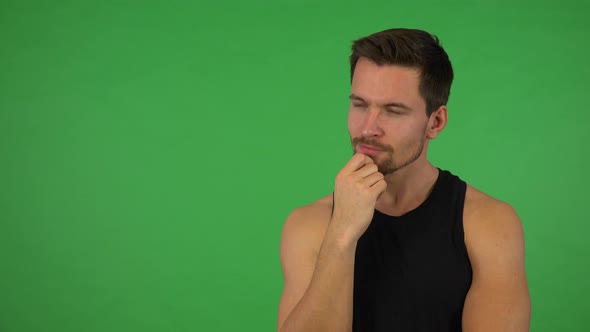 A Young Handsome Athlete Thinks About Something - Green Screen Studio