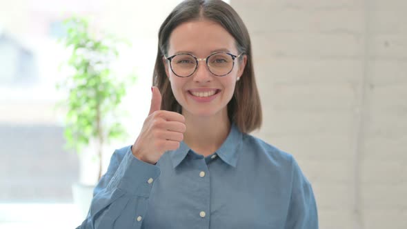 Thumbs Up by Smiling Woman