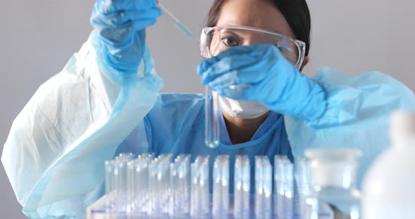 Woman scientist doing research in laboratory