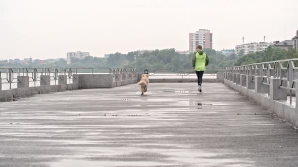 Doggie Running with His Teenage Owner