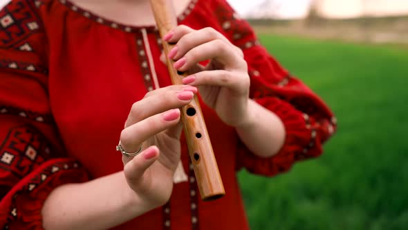 Woman Playing Woodwind Wooden Flute  Ukrainian Sopilka Outdoors
