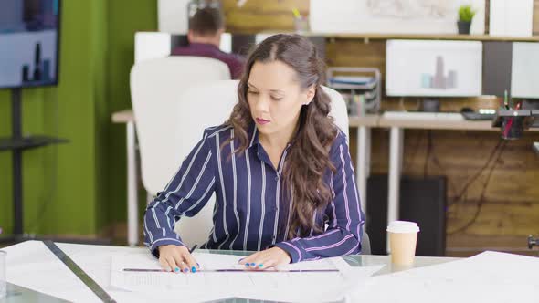 Young Female Architect Working on a New Home Project