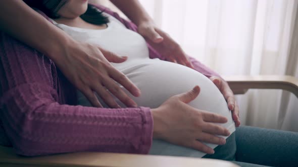 Pregnant Couple Feels Love and Relax at Home