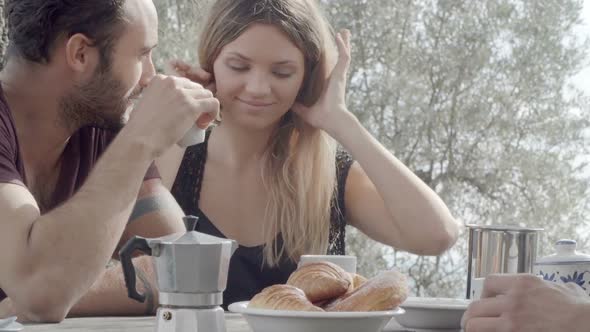 Couple of Happy Man and Woman Friends Smile Laugh and Drink Coffee During Italian Breakfast in