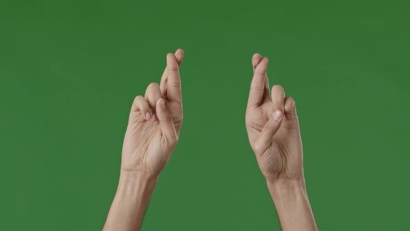 Close Up Part of Male Human Body Young Guy Unknown Man Prayer Crossing Fingers in Green Studio