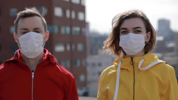 Virus Epidemic Covid-19 Is Finish in a City, Woman and Man Take Off Surgical Masks