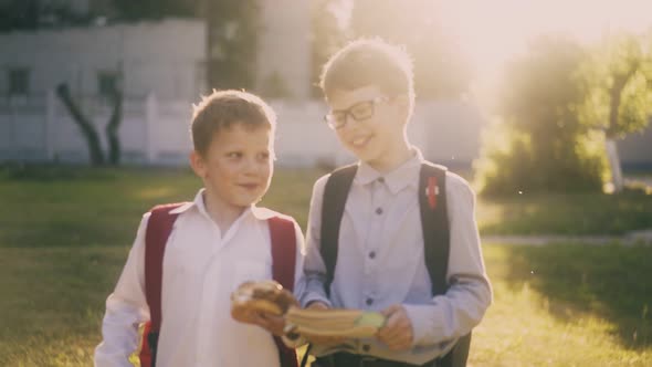 Friends Have Fun Walking After Lessons in Park Slow Motion