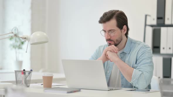 Young Man Laptop Thinking Work