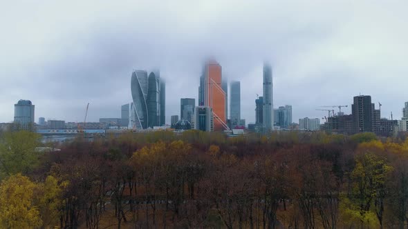 Modern skyscrapers in Moscow-City. Tops of the buildings are hidden in clouds