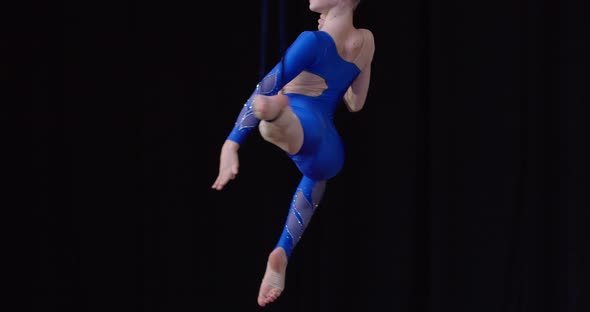 Young Girl is Doing Aerial Gymnastics on Stage Split in the Air