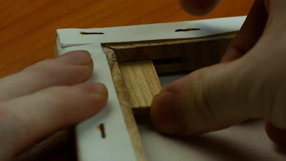 Making and stretching the host with wooden struts