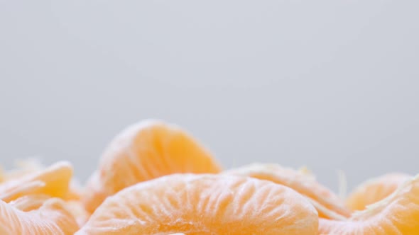 Juicy orange  peeled off on white surface slow tilting 4K 2160p 30fps UltraHD video - Healthy Citrus