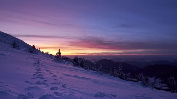 Colorful twilight over the winter mountain landscape, beautiful coloring, slow delay