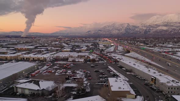 Aerial view of traffic during sunset over industrial area in Utah