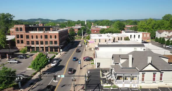 Downtown Franklin, Tennessee with drone video moving forward past clock tower.