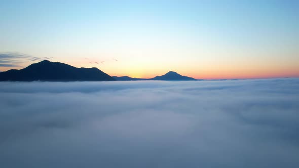 4K Drone Flying in the clouds. Flying through the clouds during sunrise