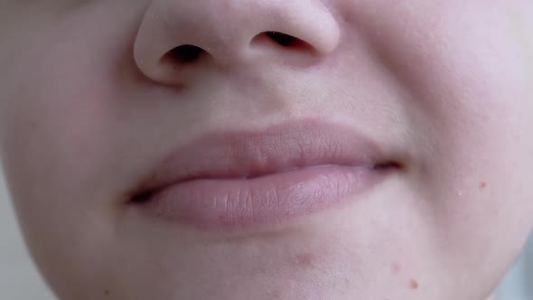 Closeup of the Lips of a Smiling Child