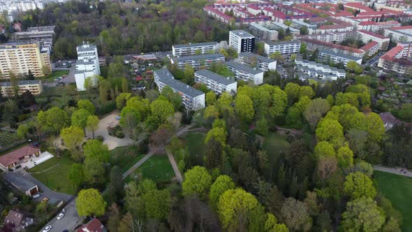 In the distance on the horizon far away the Berlin TV tower. Stunning aerial view flight slowly tilt