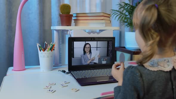 Cute Kid Pupil Watching Video Lesson Studying Using Digital Laptop Computer Doing Homework Online