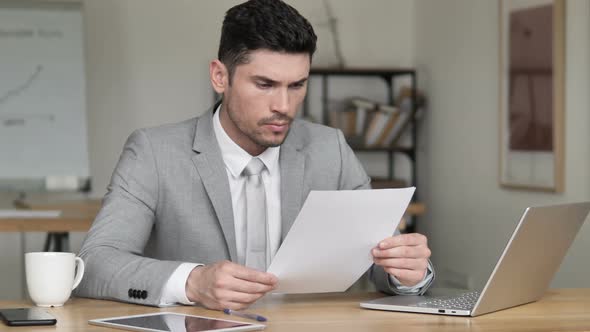 Businessman Reading Documents, Contract