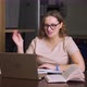 Woman is Sitting at Desk and Studying Online Communicating with Colleagues Via Video - VideoHive Item for Sale