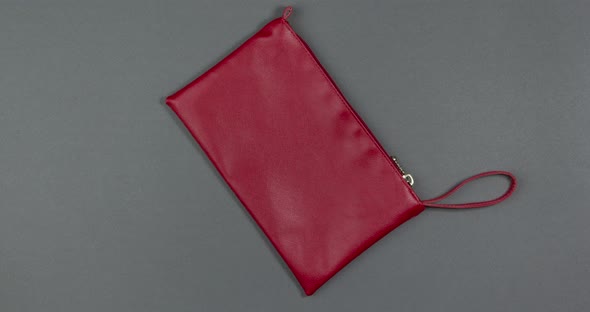 Women's Cosmetics and Makeup Tools Fly Into an Open Cosmetic Bag Stop Motion Animation alt