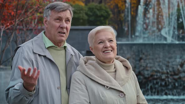 Married Old Romantic Caucasian Grandparents Couple Spouses Strolling Rest Time Together Emotional