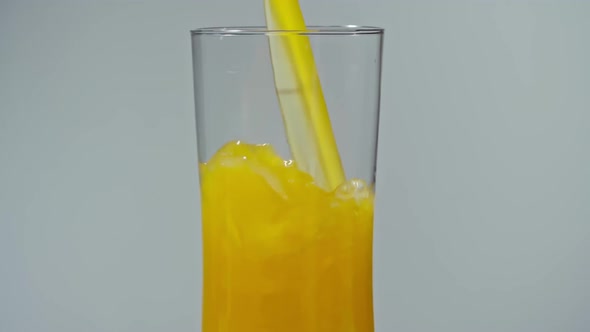 Pouring Fresh Squeezed Citrus Juice into Glass