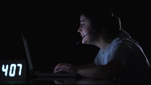 Anxious Lady Gamer Happy About Winning Game Playing Computer Late at Night