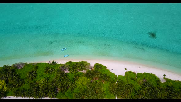 Aerial flying over sky of tranquil coast beach trip by transparent sea and white sandy background of