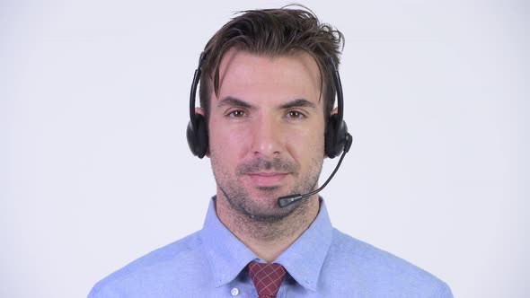 Young Happy Hispanic Businessman As Call Center Representative