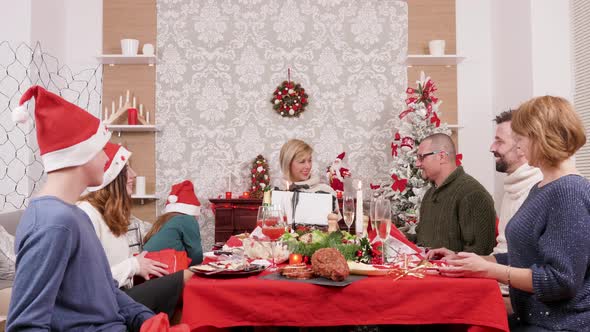 Big Family Gives Each Other Gift Boxes for Christmas Celebration