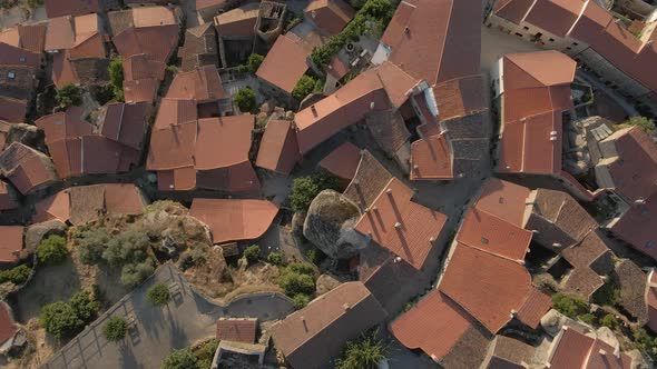 Aerial rising vertigo over roofs at Monsanto village, Portugal