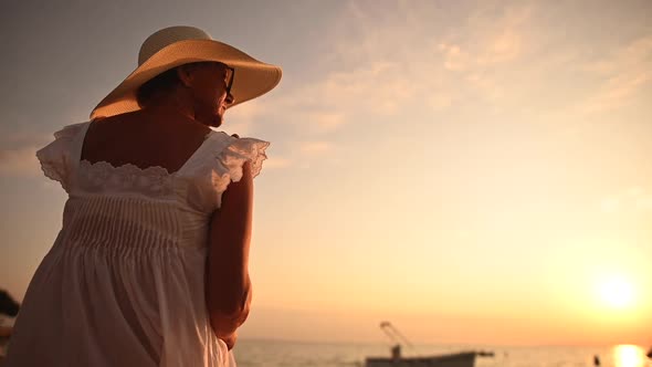 Woman Enjoying Retirement Vacation on the Beach