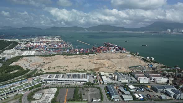 Aerial drone view of landfill and Cargo Pier in Tuen Mun, Hong Kong. Cloudy day