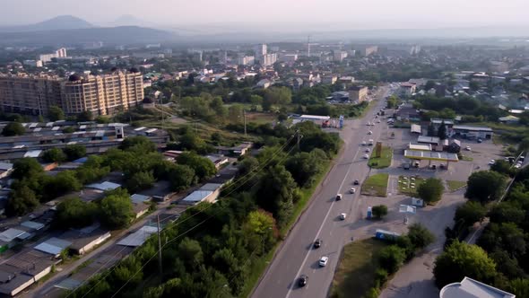 Drone Flight Over the City at Sunset