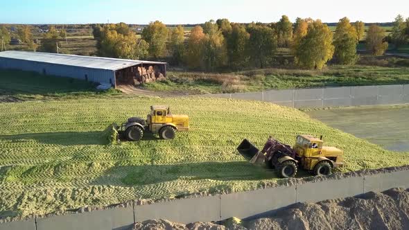 Aerial View Machines Work in Pit Ramming Silo at Farm